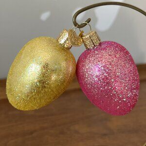 2 Old World Christmas Easter Egg Blown Glass Ornaments Pink Yellow Glitter Merck